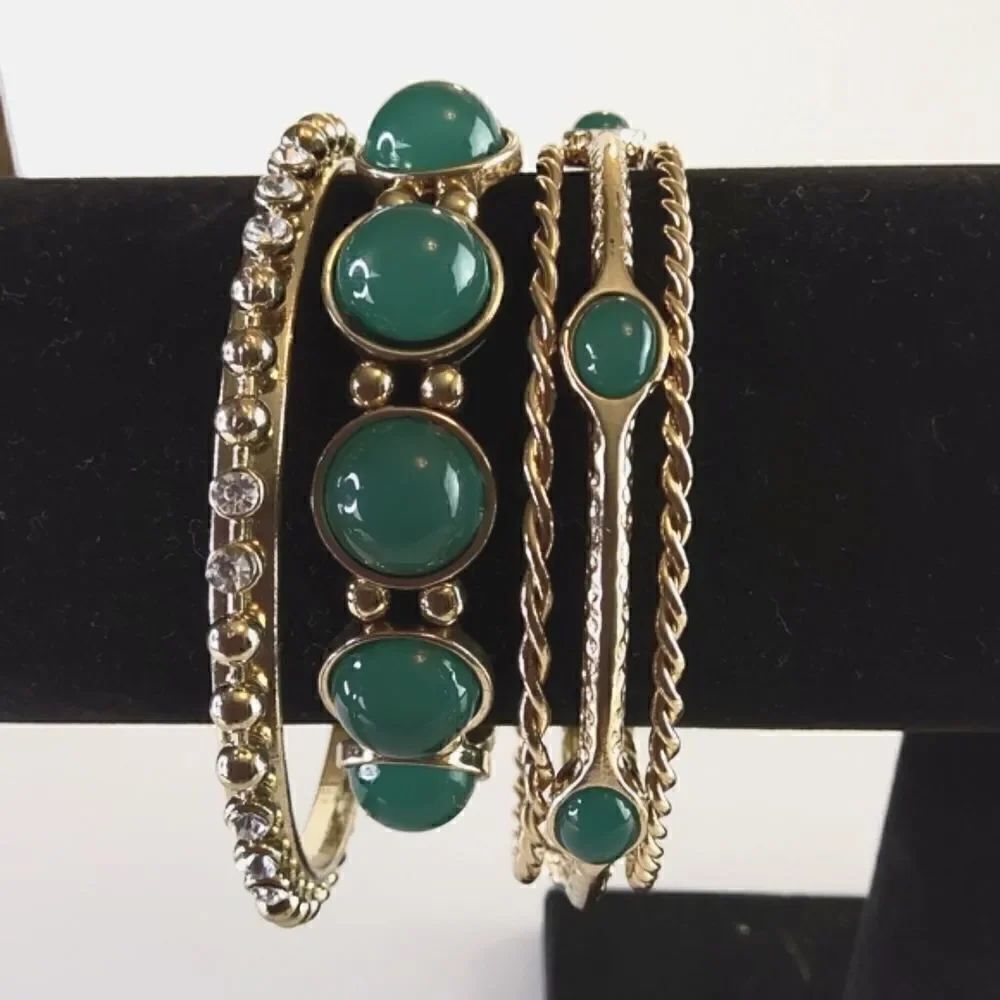 Fashion jewelry five piece faux emerald and gold tone bracelet set